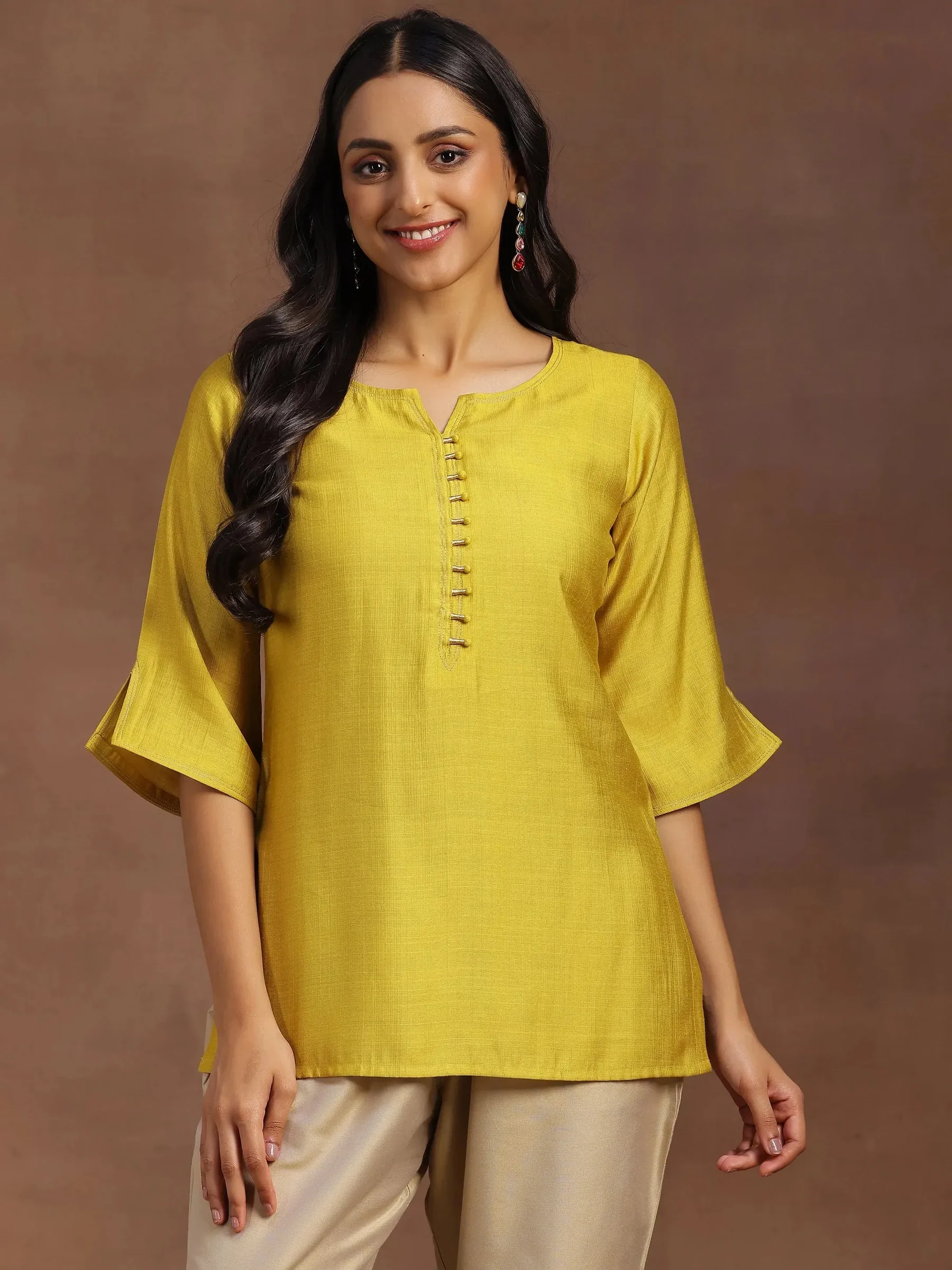 1_46f99ed6-dc77-47ef-8adc-1a04298ad381.webp Yellow Solid Silk Blend Straight Kurti - Image 1